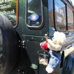 H4H Big Ted working on the team Land Rover.